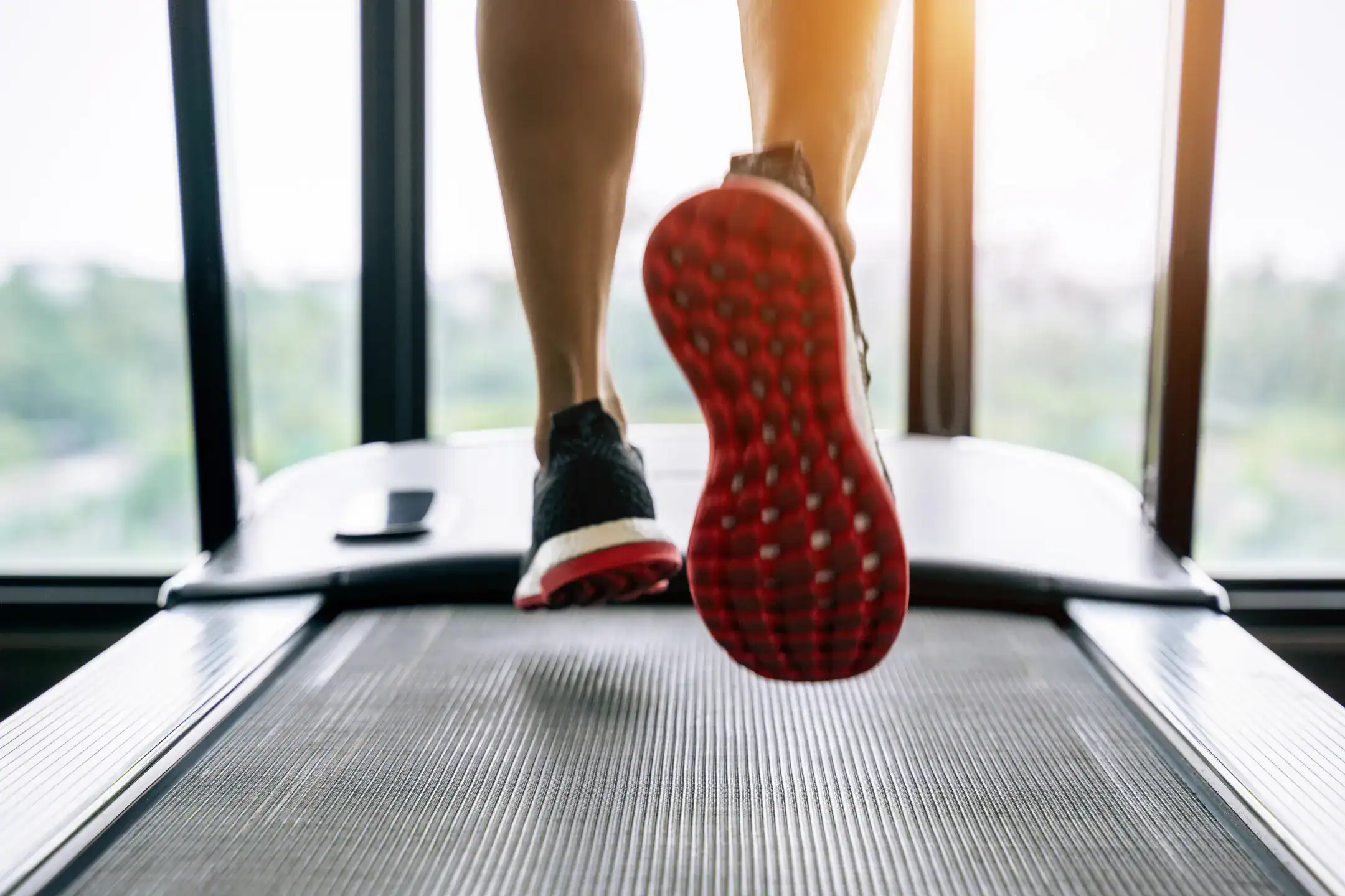 Gait Analysis: What It Is & Who Needs It 1 male feet sneakers running treadmill gym exercise concept